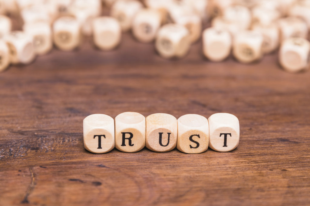 trust-word-made-with-wooden-blocks
